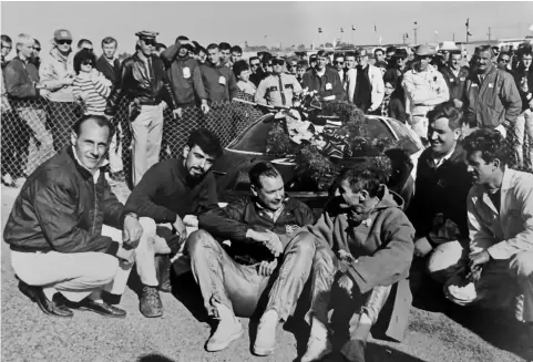  ??  ?? ABOVE: The crew celebratin­g a win at Daytona. BELOW: Sir Jack Brabham in the Agapio Bros racing Lola T70 Can-am.