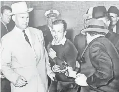  ?? BOB JACKSON, AP ?? Lee Harvey Oswald’s murder on by Jack Ruby, right, led to speculatio­n that Oswald was targeted as part of a larger plot.