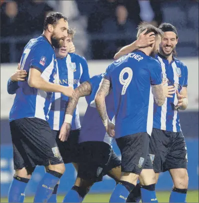  ?? PICTURE: STEVE ELLIS ?? ALL SMILES: Sheffield Wednesday players celebrate after Atdhe Nuhiu, left, scored the only goal of the game last night in their FA Cup third-round replay against Luton Town at Kenilworth Road. Their fourth-round opponents will be holders Chelsea at Stamford Bridge.