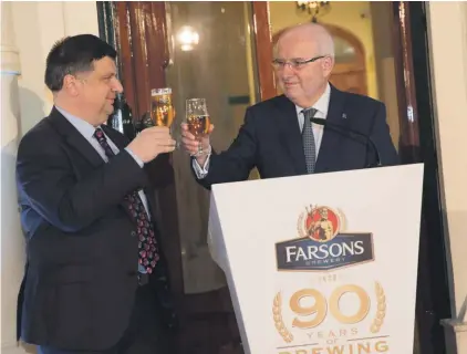  ??  ?? (from left) Qormi Mayor Jesmond Aquilina and Farsons Group Chairman Louis A Farrugia celebratin­g Farsons’ first beer delivery to Qormi 90 years ago