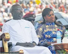  ?? AP ?? Liberia’s new president, George Weah, left, and his wife, Clar Weah, sit during his inaugurati­on ceremony in Monrovia, Liberia.