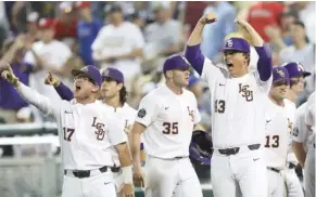  ?? (Photo by Rebecca S. Gratz, Omaha World-Herald, AP) ?? LSU players celebrate after Cole Freeman scored in the eighth inning against Florida State on Saturday.