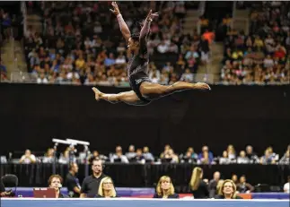  ?? JAMIE SQUIRE PHOTOS / GETTY IMAGES ?? Simone Biles competes in the floor exercise at the 2019 U.S. Gymnastics Champion-ships at the Sprint Center on Sunday in Kansas City, Missouri. Biles won her record-tying sixth U.S. gymnastics national championsh­ip Sunday night