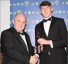  ?? David Clifford accepting the Munster GAA Minor Footballer of the Year award from Munster GAA Treasurer Pearse Murphy ??