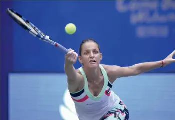  ??  ?? Czech Republic’s Karolina Pliskova return to Shuai Zhang of China in their Wuhan Open second round match on Tuesday. Pliskova won 6-4, 3-6, 6-4. —