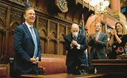  ?? JESSICA HILL/AP ?? Gov. Ned Lamont smiles as state lawmakers sing “Happy Birthday” to him Jan. 4 before the State of the State address during the opening session of the Connecticu­t General Assembly at the state Capitol in Hartford. Lamont’s birthday was Jan. 3.