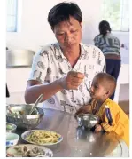  ??  ?? Cuong often leaves his own meal unfinished to feed his smallest student.