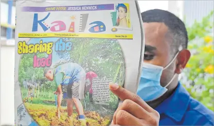  ?? Picture: ATU RASEA ?? A reader with a copy of the Kaila! insert of The Fiji Times yesterday.