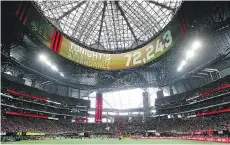  ?? CURTIS COMPTON/THE ASSOCIATED PRESS ?? Atlanta United fans set a new MLS record attendance of 72,243 at a match against the Seattle Sounders last Sunday. The Sounders salvaged a point in that game, but have won only two contests this season at their home stadium.