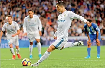  ?? AP ?? Real Madrid’s Cristiano Ronaldo (above) in action during their Spanish league football match against Malaga at the Santiago Bernabeu stadium in Madrid, on Saturday. Real won 3-2. Below: Moenchengl­adbach’s Denis Zakaria (left) and Bayern’s Sebastian...