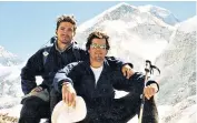  ??  ?? Michael Matthews, on the left, posing before the summit of Everest. James’s parents, David and Jane Matthews, below left