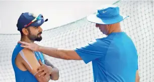  ?? PTI ?? Indian skipper Virat Kohli with team physiother­apist Patrick Farhart during a practice session. —