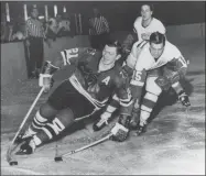  ?? Associated Press ?? Stan Mikita, left, who played for the Blackhawks for 22 seasons and became one of the franchise’s most revered figures, died Aug. 7. He was 78.