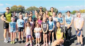  ?? ?? Junior netballers have their photo taken with Central Pulse players at the end of the training session at Donnelly Park at the weekend.