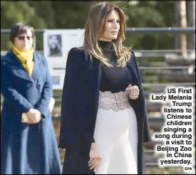  ?? EPA ?? US First Lady Melania Trump listens to Chinese children singing a song during a visit to Beijing Zoo in China yesterday.