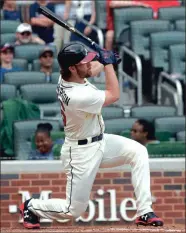  ?? JOHN AMIS / The Associated Press ?? Atlanta’s Charlie Culberson follows through with his swing on his two-run walk-off homer on Sunday.