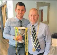  ??  ?? Argyll Select captain, Fraser Talbot, receives the Joe Paterson Memorial Trophy from Scottish Amateur Football League president Matt Armstrong.