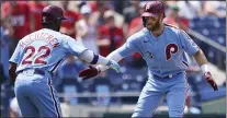  ?? RICH SCHULTZ - THE ASSOCIATED PRESS ?? Phillies’ Bryce Harper, right, is congratula­ted by Andrew McCutchen after Harper hit a first inning home run against the Dodgers Thursday at Citizens Bank Park.