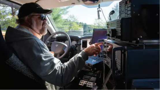  ??  ?? RFI technician Chuck Niday drives his truck through the GBO.