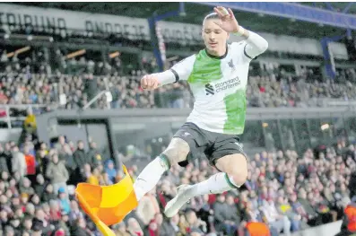  ?? AP ?? Liverpool’s Darwin Nunez kicks the corner flag as he celebrates after scoring his side’s third goal during the Europa League round of 16 first leg, match between Sparta Praha and Liverpool at the Epet Arena in Prague, Czech Republic yesterday.