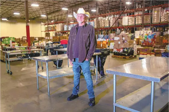  ?? JON AUSTRIA/JOURNAL ?? Dana Yost, president and CEO of Roadrunner Food Bank, stands in the nonprofit’s Albuquerqu­e warehouse.