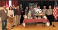  ??  ?? From left, Rotary Club members, Robin Hendry, Michele Ryan, O. Perry Tooker III, Greg Owens, Mike DeBottis, Catherine Docous, O. Perry Tooker IV, Steve Potter, Mary Pat Adams, Vince Mellon and Kevin Davies.