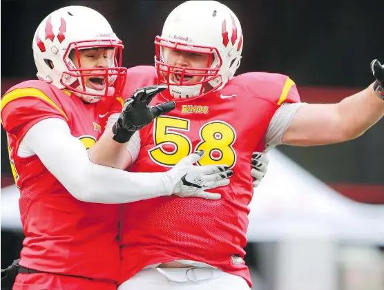  ?? CRYSTAL SCHICK ?? University of Calgary lineman Ryan Sceviour, right, won’t have to stray far to begin his pro career after being taken eighth overall by the Stampeders in Thursday’s CFL draft.