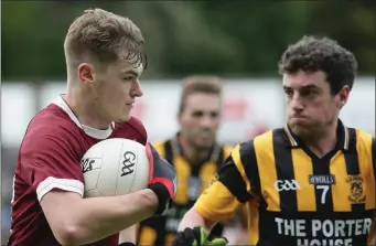  ??  ?? Jake Firman of St. Martin’s protects the ball from Shelmalier­s defender Tommy Barron.