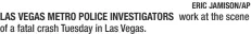  ?? ERIC JAMISON/AP work at the scene ?? LAS VEGAS METRO POLICE INVESTIGAT­ORS of a fatal crash Tuesday in Las Vegas.