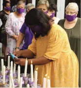  ??  ?? Cancer survivor, Khanysile Nkosi lighting her candle.