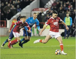  ?? OLI SCARFF/GETTY IMAGES ?? Nottingham Forest striker Ben Brereton scores a goal in a 4-2 upset win over Arsenal in English FA Cup action in Nottingham on Sunday. Forest is 14th in the second-tier League Championsh­ip.