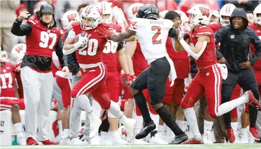  ?? JOHN FISHER/GETTY IMAGES ?? Wisconsin’s Isaac Guerendo (12 carries, 114 yards) breaks off an 89-yard touchdown run in the second quarter Saturday against visiting Maryland.