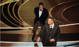  ?? Photograph: Rob Latour/REX/Shuttersto­ck ?? Chris Rock reacts after being slapped by Will Smith at the Oscars.