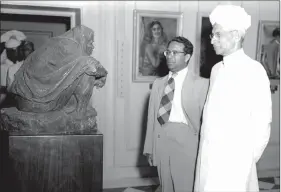  ??  ?? Dr. Sarvepalli Radhakrish­nan and Humayun Kabir (in a suit) at the NGMA on 29 March 1954.