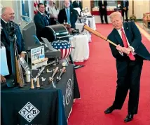  ?? AP ?? President Donald Trump swings a baseball bat during the Spirit of America Showcase at the White House yesterday in Washington.