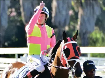  ?? Photo JC Photograph­ics ?? RYAN Munger in familiar fashion: on his way to the winner’s enclosure. He has decided to ply his trade in Canada from next month.