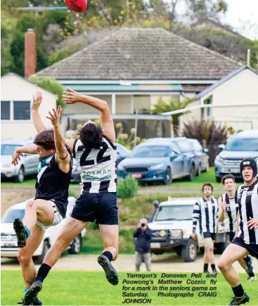  ??  ?? Yarragon’s Donovan Pell and Poowong’s Matthew Cozzio fly for a mark in the seniors game on Saturday. Photograph­s CRAIG JOHNSON