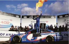  ?? Jared C. Tilton / Getty Images ?? Hendrick Motorsport­s’ Kyle Larson celebrates after winning and moving into the round of eight in the NASCAR playoffs.