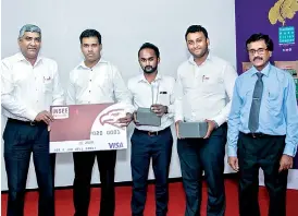  ??  ?? Insee Cement CEO Nandana Ekanayake (Left) and Sri Lanka Standards Institute Former Director General Gamini Dharmaward­ena presenting the award and cash prize to Colombo Head Office - The winning team of Insee Debate Competitio­n held in celebratio­n of...