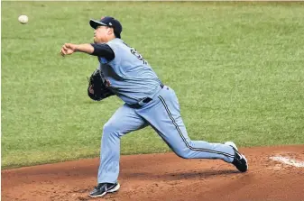  ?? USA TODAY SPORTS ?? Toronto Blue Jays pitcher Hyun Jin Ryu, seen here throwing throwing against the Tampa Bay Rays in Game 2 of their wild card playoff series on Sept. 30, will be a key player for the Jays in 2021.