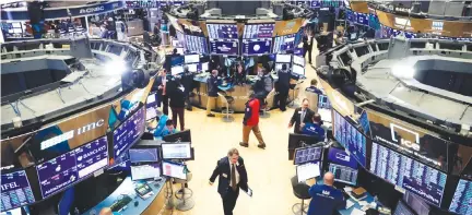  ?? REUTERS ?? TRADERS work on the floor of the New York Stock Exchange (NYSE) after the opening bell of the trading session in New York, US, March 13.