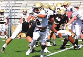  ?? File-FRANK CROWE / For the Calhoun Times ?? Calhoun’s Olico Dennis looks for running room during the Jackets’ spring Game in May. The Jackets will open official practice on Monday. Gordon Central will also open on Monday, and Sonoravill­e will start practice on Tuesday.