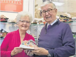  ?? DAVE STEWART • SALTWIRE NETWORK ?? Wayne Proude, right, the owner of Proude’s Shoes in Charlottet­own is retiring May 12 after 65 years in the shoe-selling business. His wife, Judy, said she’s got a long to-do list waiting.