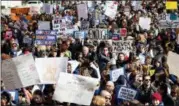  ?? CRAIG RUTTLE — THE ASSOCIATED PRESS ?? People take part in a march rally against gun violence Saturday, March 24, 2018, in New York. Tens of thousands of people poured into the nation’s capital and cities across America on Saturday to march for gun control and ignite political activism...