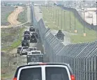  ??  ?? A motorcade carrying President Trump drives along the border to look at wall prototypes, on March 13 in San Diego. EVAN VUCCI/AP