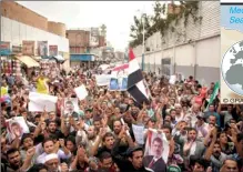  ??  ?? Supporters of deposed Egyptian President Mohamed Mursi shout slogans as they gather outside the Egyptian embassy in Sanaa to show solidarity with his supporters in Egypt July 28, 2013. (REUTERS/Khaled Abdullah)