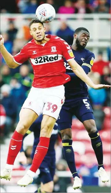  ??  ?? UP FOR IT: Boro’s Rudy Gestede and Derby County’s Fikayo Tomori battle for the ball