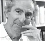  ?? AP file photo/RICHARD DREW ?? author Philip Roth poses for a photo in the offices of his publisher, Houghton Mifflin, in New York. Roth, prize-winning novelist and fearless narrator of sex, religion and mortality, has died at age 85, his literary agent said on May 22.