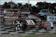  ?? RICK KEPNER — FOR DIGITAL FIRST MEDIA ?? Craig Whitmoyer celebrates in victory lane after winning the modified feature on July 8 at Grandview.