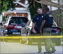  ?? BEN HENDREN FOR THE AJC ?? Three Atlanta police officers were recovering Sunday after being shot in the Capitol View neighborho­od in the 1400 block of DeSoto Avenue on Saturday afternoon.